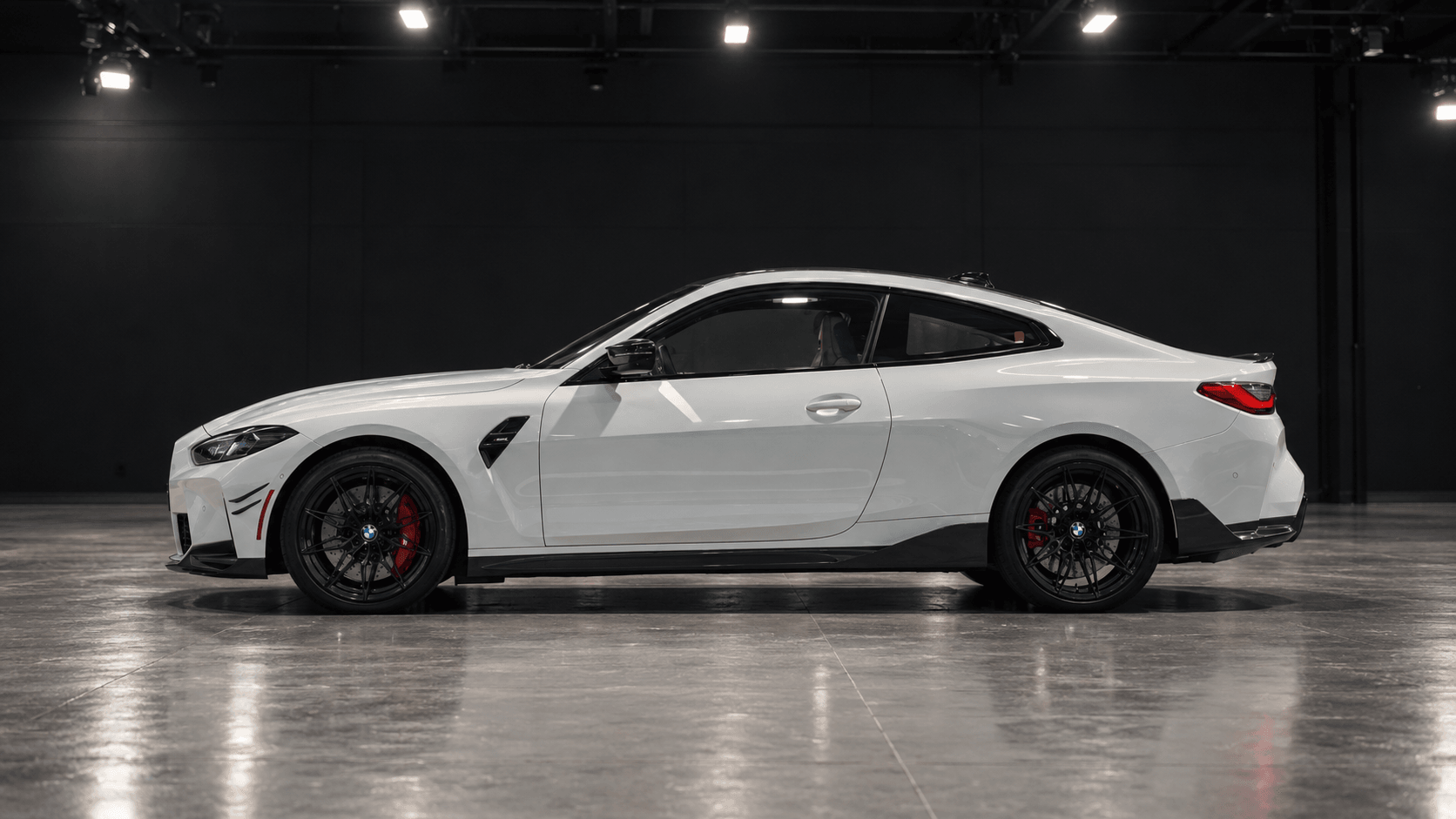 BMW M4 in factory gloss white paint before wrapping